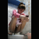 A pretty Asian woman takes a piss and shit into a floor toilet while playing with her mobile phone. She uses a spray hose to clean off her ass and pussy. Video appears to have been captured by hidden camera. 720P vertical HD format. About 3 minutes.